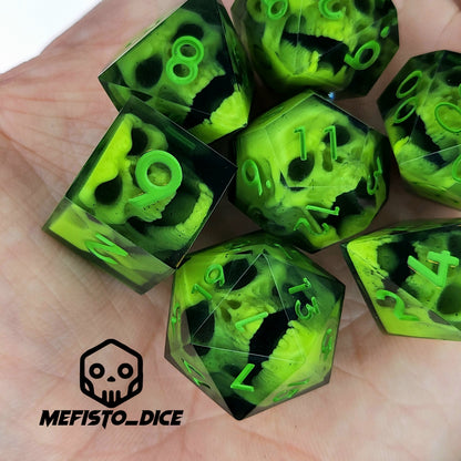 Close-up of black resin dice with neon-green undead zombie skulls and bright green numbers, handcrafted by Mefisto_Dice.