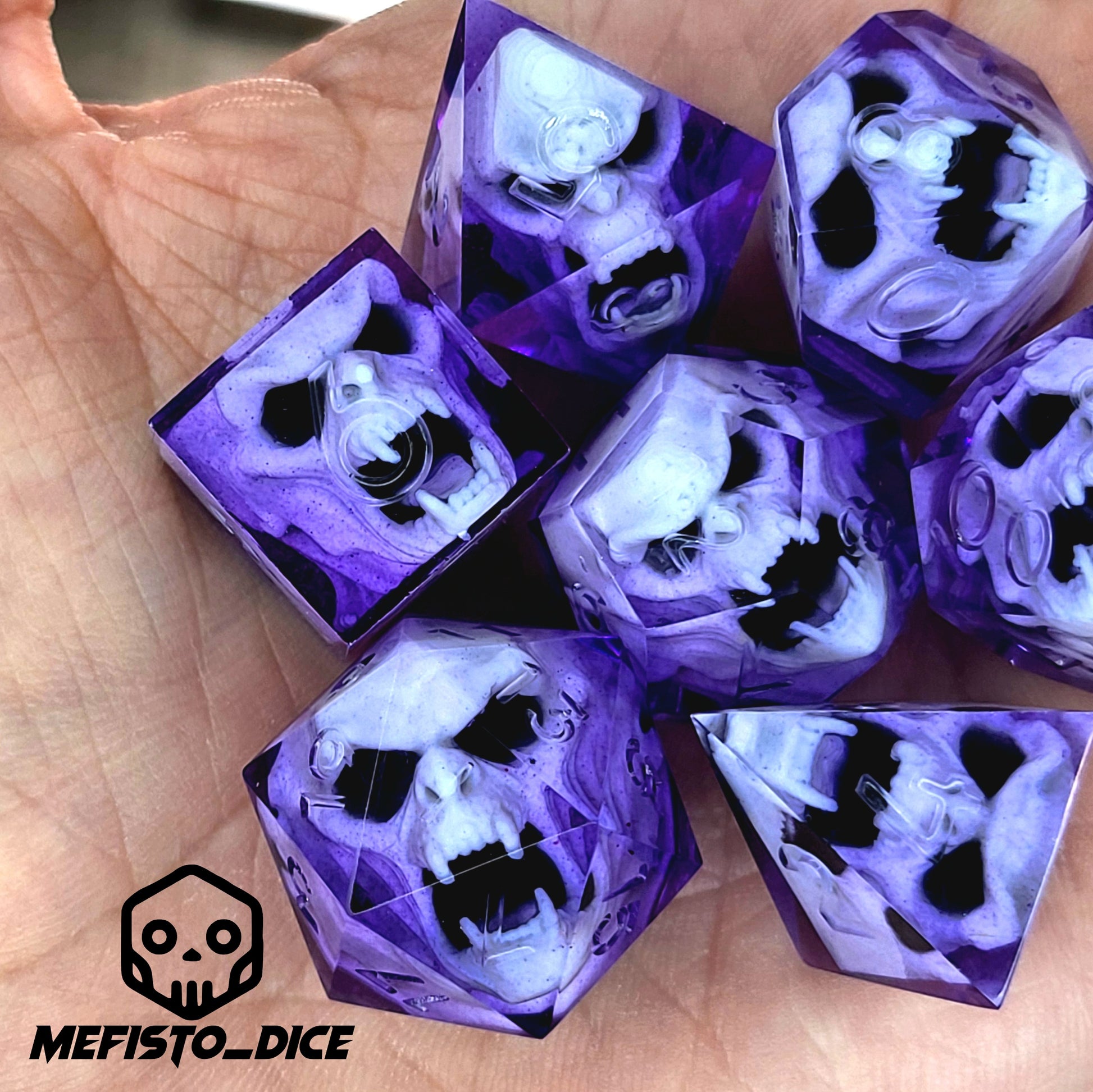 Purple resin DnD dice set with detailed white vampire skulls inside