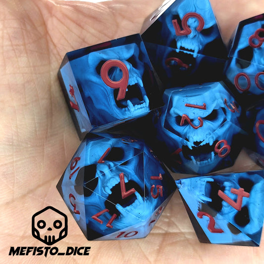 Blue resin DnD dice set with light blue skulls inside and red engraved numbers