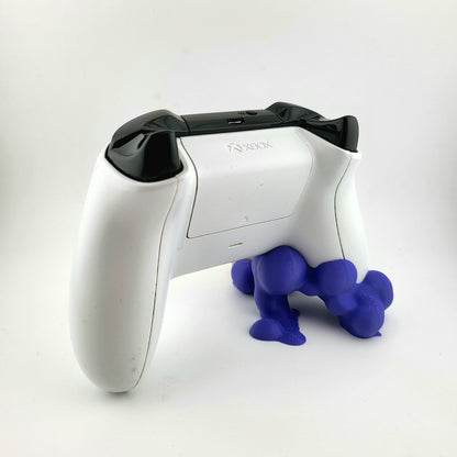 One xbox controller stand featuring a skull design and purple smoke, 3D printed  with high-quality PLA.
