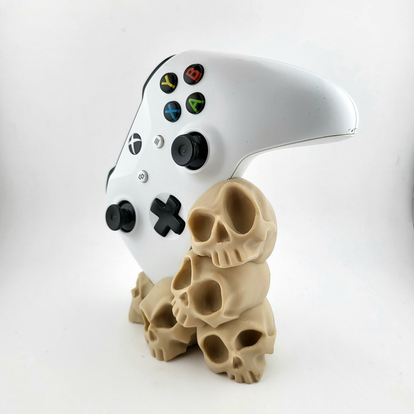 One xbox controller stand featuring a skull tower design , 3D printed  with high-quality PLA.