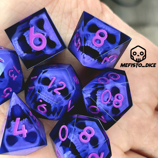 Close-up of black resin dice with purple zombie skulls inside and pink numbers, handcrafted by Mefisto_Dice.
