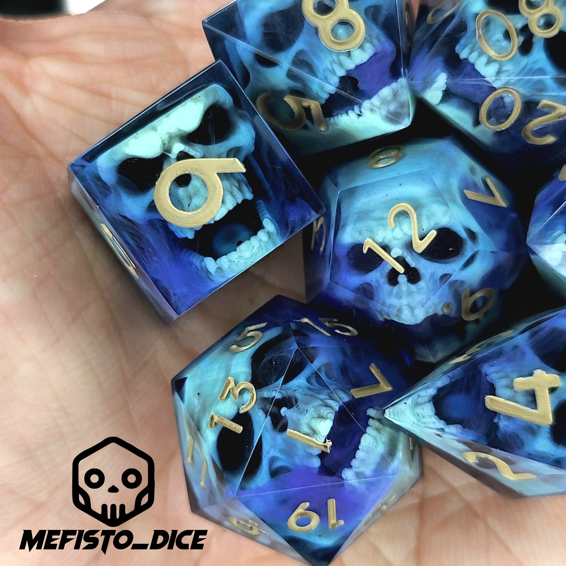Black resin dice set with light green undead skulls, purple smoky swirls and gold numbers, handcrafted RPG dice for DnD and fantasy tabletop games