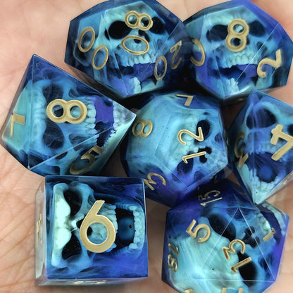 Black resin dice set with light green undead skulls, purple smoky swirls and gold numbers, handcrafted RPG dice for DnD and fantasy tabletop games