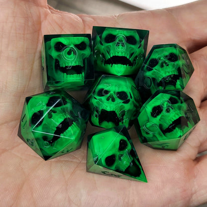 Black resin DnD dice set with bright green zombie skulls inside