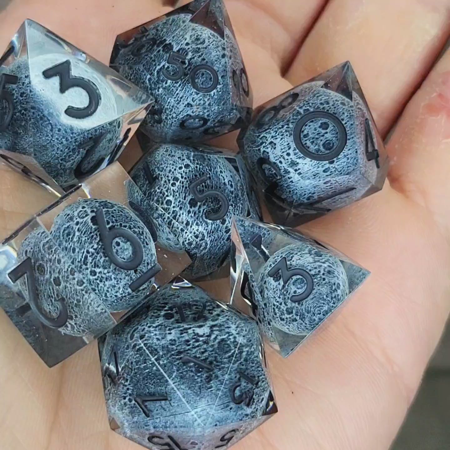 Dice set with moon inside and black numbers for play dnd , dungeons and dragons