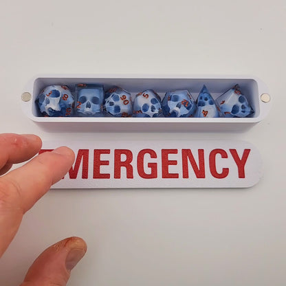 dice box white and red with the word emergency printed on it for dnd and dungeons and dragons games