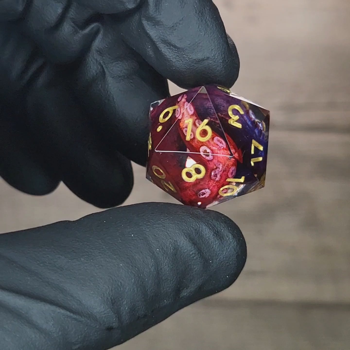 D20 dice with red and blue tentacles inside and gold numbers for play dnd , dungeons and dragons