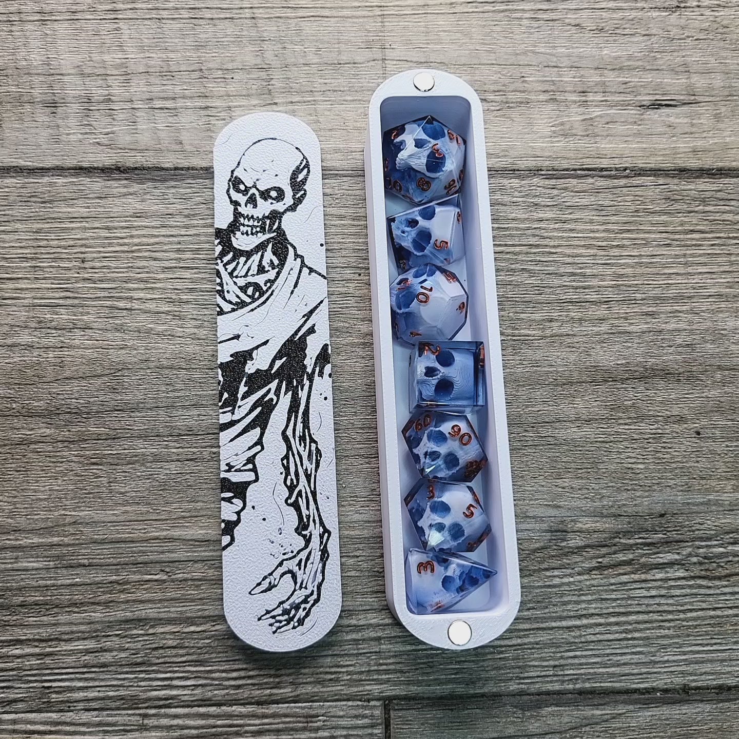 dice box white and black with the undead zombie printed on it for dnd and dungeons and dragons games