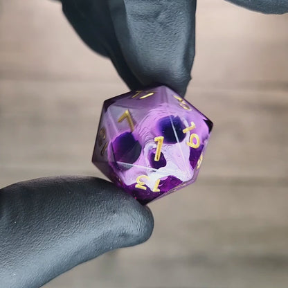 This is a single set of one D20 DnD die with a white skull inside , purple resin and gold numbers