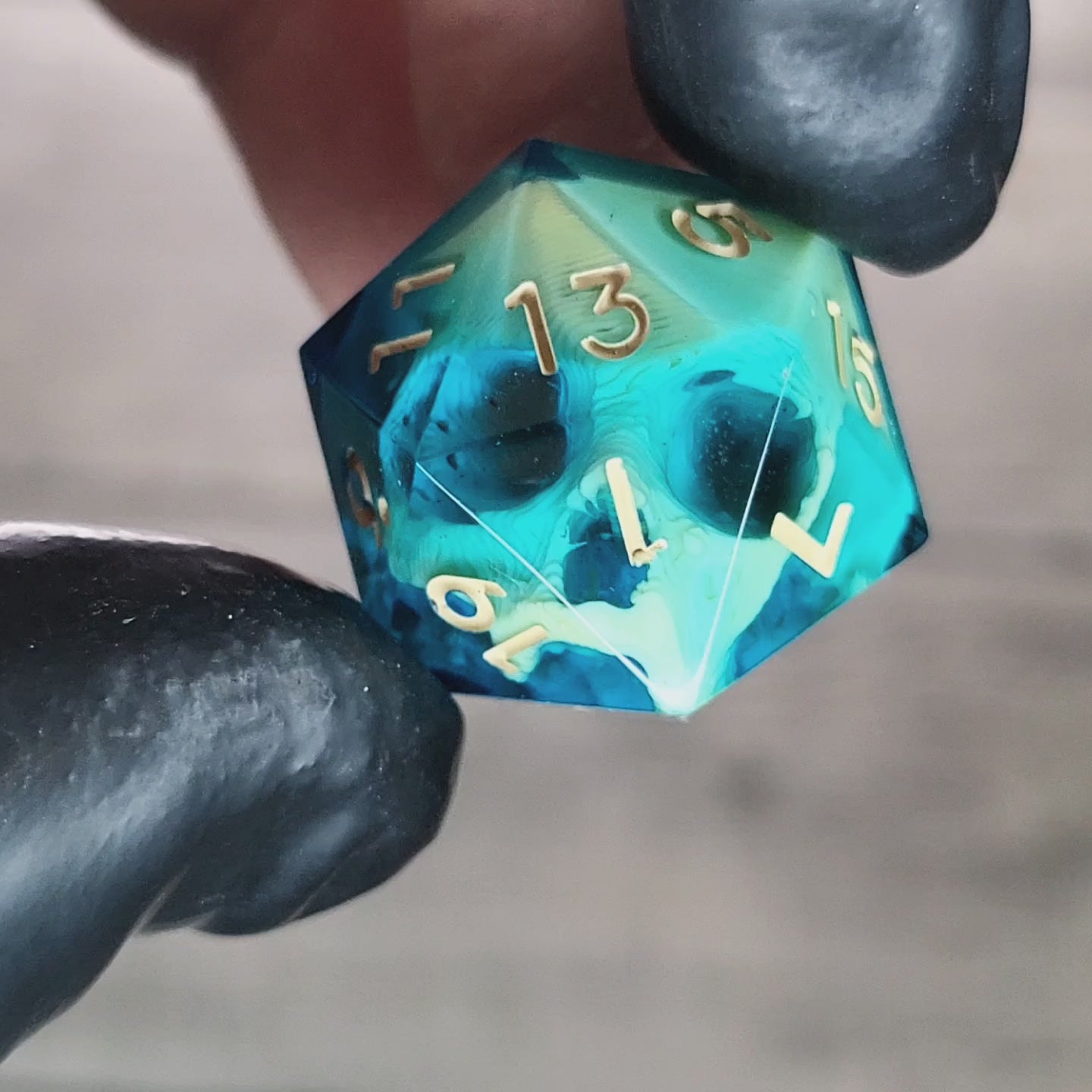 This is a single set of one D20 die with a light brown skull inside , blue resin and light brown numbers for play dnd dungeons and dragons